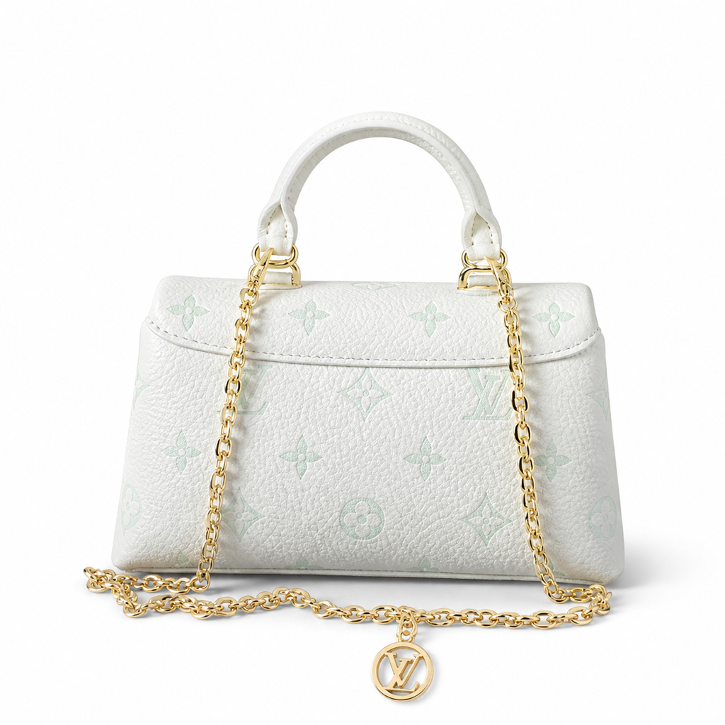 Louis Vuitton Madeleine BB — Monogram Empreinte Leather in Crème with Gold LV Lock