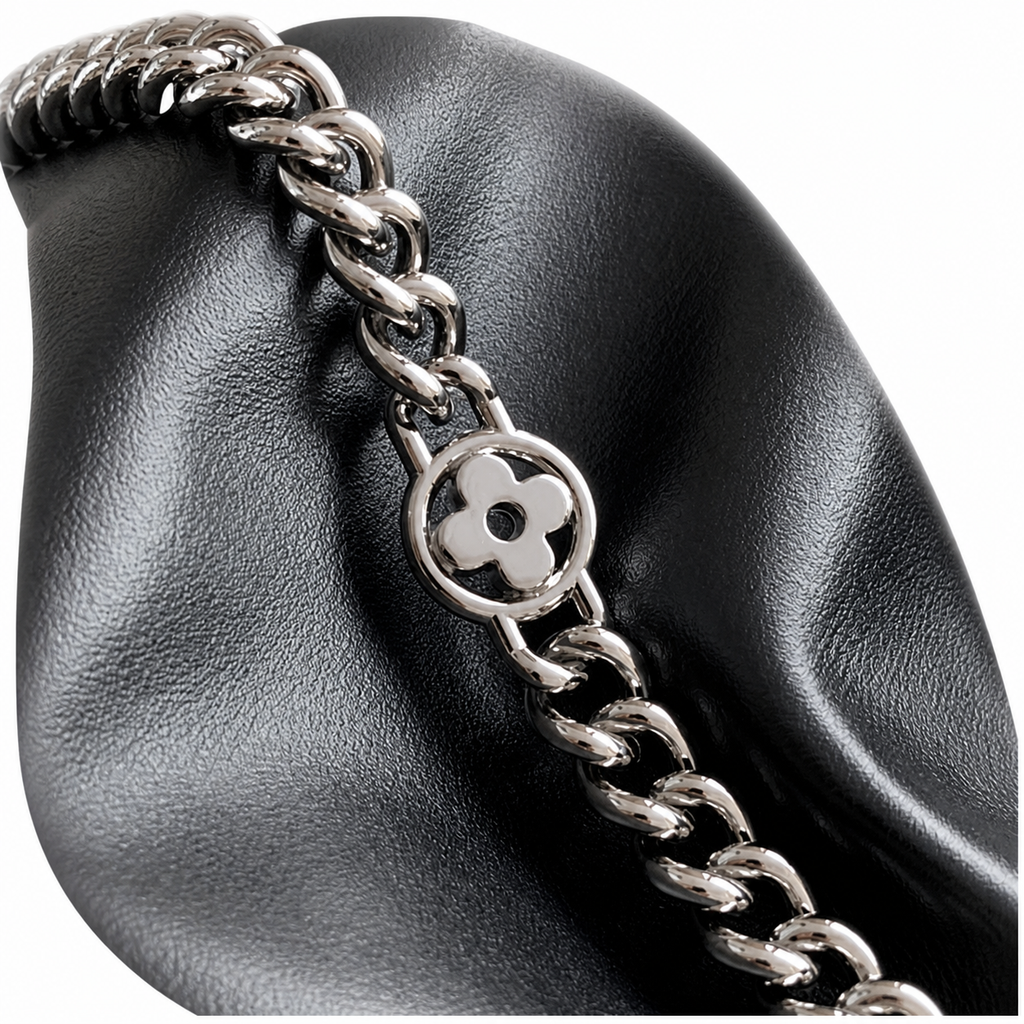 Saint Laurent Drawstring Bucket Bag — Noir Calfskin, Quatrefoil Chain Handle, Leather Drawstring & Tassel