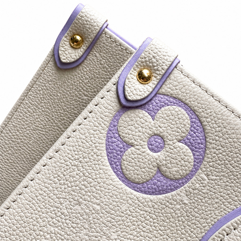 Louis Vuitton OnTheGo MM — Monogram Empreinte Leather in Crème with Lavender Trim & Interior